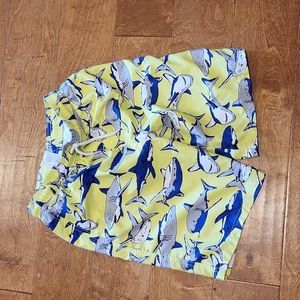Carters new, size 12/12A swim trunks, yellow with Blue and Grey sharks